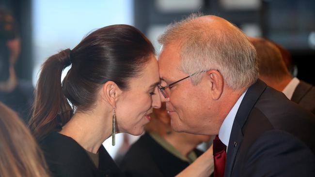 Ms Ardern gives former Australian prime minister Scott Morrison a traditional hongi greeting. Ms Ardern worked with three Australian prime ministers in her tenure. Picture: NCA NewsWire / Picture Calum Robertson