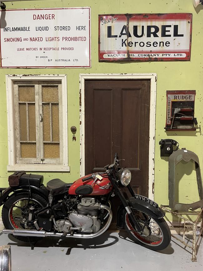 Vintage motorcycle and signage from Roadside Relics on Brisbane Road, Gympie.