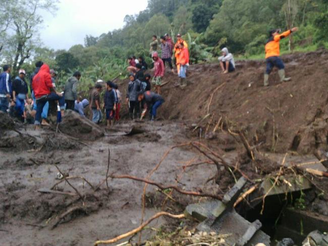 A supplied image obtained Friday, Feb.10, 2017 of the Songan Village in Bali after a landslide. Seven people were killed and four homes buried when a landslide hit Songan Village in Bali's north-east on Thursday night. (AAP Image/National Disaster Management Board) NO ARCHIVING, EDITORIAL USE ONLY