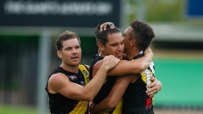 Cameron Ilett (centre) celebrates a goal with teammates Brodie Filo, left and Michael Hagan. Picture: Glenn Campbell