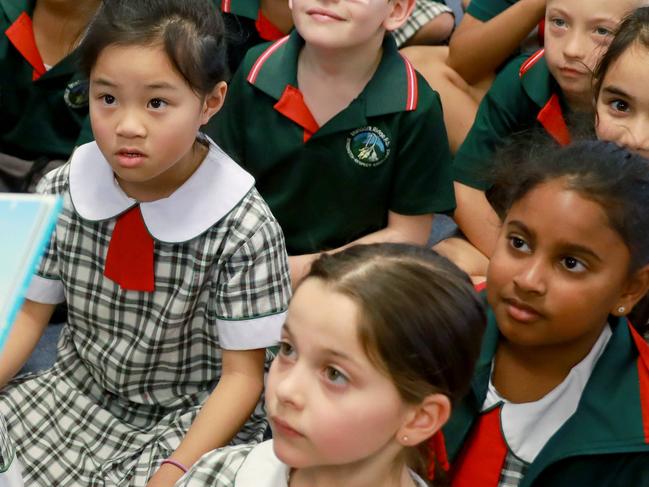 ROUSE HILL TIMES/AAP. Assistant Principal Simone Williams reads a book to the year 2 lass at Ironbark Public School in Rouse Hill on Friday 13 September, 2019. Ironbark Public School is the second fastest growing school in the Rouse Hills area. But it also has the second highest teacher to student ratio in the area. (AAP IMAGE / Angelo Velardo)