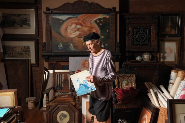 Otto in the coach house in his garden, holding the sketch he made from a Norman Lindsay painting when he was about 14. Picture: Simon Bullard