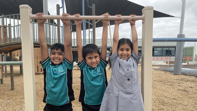 Students Divit, Sayesha and Reyu, 6, playing on the monkey bars. (Picture: Olivia Condous)