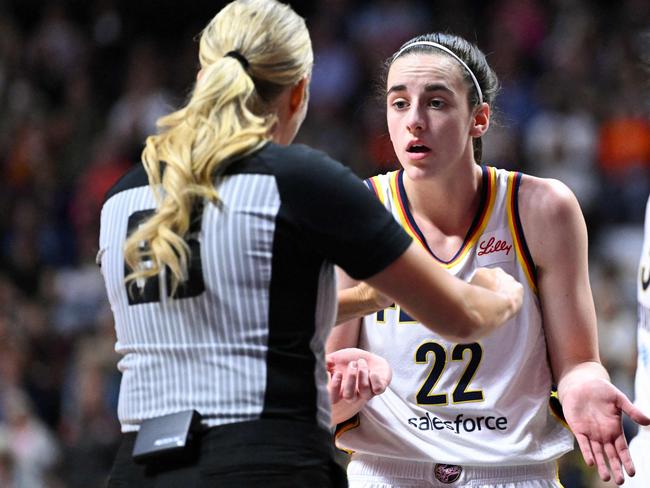 UNCASVILLE, CONNECTICUT - JUNE 10: Caitlin Clark #22 of the Indiana Fever argues with an official during the first half of a game against the Connecticut Sun at the Mohegan Sun Arena on June 10, 2024 in Uncasville, Connecticut. NOTE TO USER: User expressly acknowledges and agrees that, by downloading and or using this photograph, User is consenting to the terms and conditions of the Getty Images License Agreement.   Brian Fluharty/Getty Images/AFP (Photo by Brian Fluharty / GETTY IMAGES NORTH AMERICA / Getty Images via AFP)