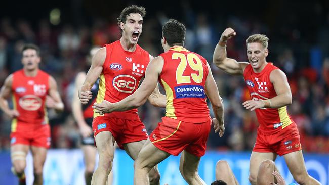 Gold Coast’s Ben King celebrates a goal against Essendon with teammate Ben Ainsworth. Picture: Getty Images