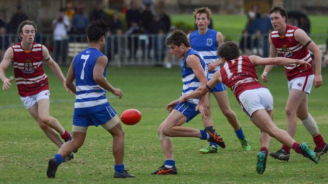 Kallis Freer (no. 17) tackles his St Peter’s opponent, during PAC’s intercol clash. Picture: Brenton Edwards