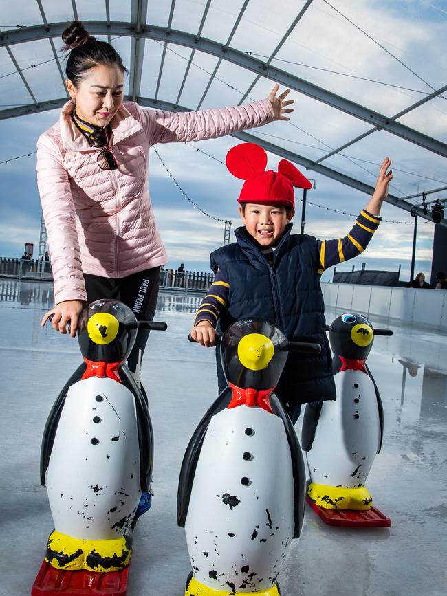 Apple Chou, Campbelltown, with her son Oscar, 5, enjoying ice skating at the Alpine Winter Festival in Glenelg. Picture: Tom Huntley