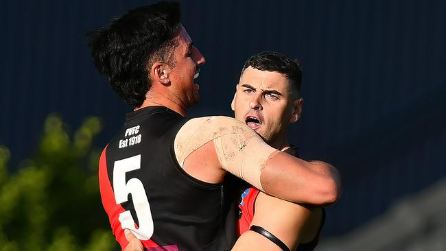 Paul Ahern of Pascoe Vale is congratulated by team mates after kicking a goal during the round two Strathmore Community Bank Premier Division Seniors match between Pascoe Vale and Strathmore at Raeburn Reserve, on April 20, 2024, in Melbourne, Australia. (Photo by Josh Chadwick)