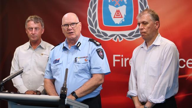 Tasmania Fire Service State Fire Controller Bruce Byatt, centre, discusses the latest on the bushfires. Picture: EDDIE SAFARIK