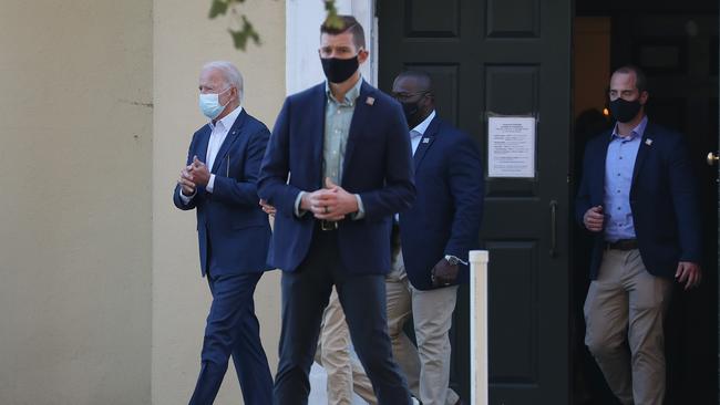 A masked president-elect Joe Biden, left, leaves St. Joseph on the Brandywine Roman Catholic Church after attending Sunday mass. Picture: Joe Raedle/Getty Images/AFP