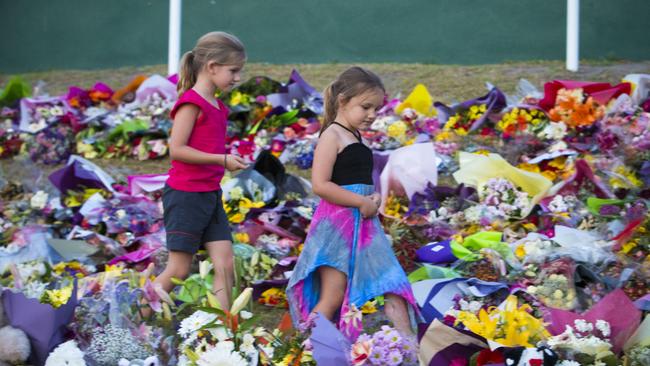 Mourners attend a candlelight vigil outside Dreamworld on October 28, 2016 (Photo by Glenn Hunt/Getty Images)