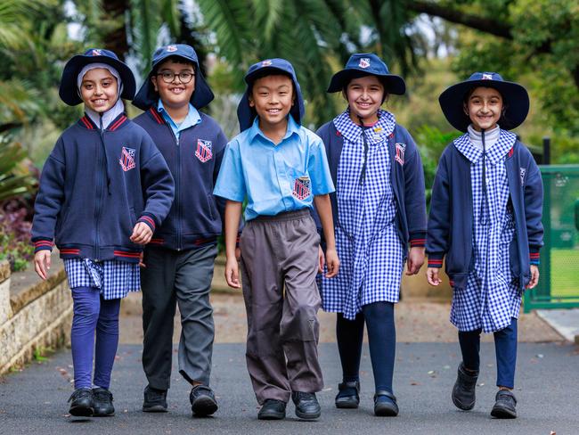 Auburn North Public School Year 3 pupils Usaila Ahmad, Umar Naik, Sidhant Lama, Zainab Sarshar and Aisha Arsalan. Their school focuses on making sure parents are involved in students’ literacy and numeracy. Picture: Justin Lloyd.