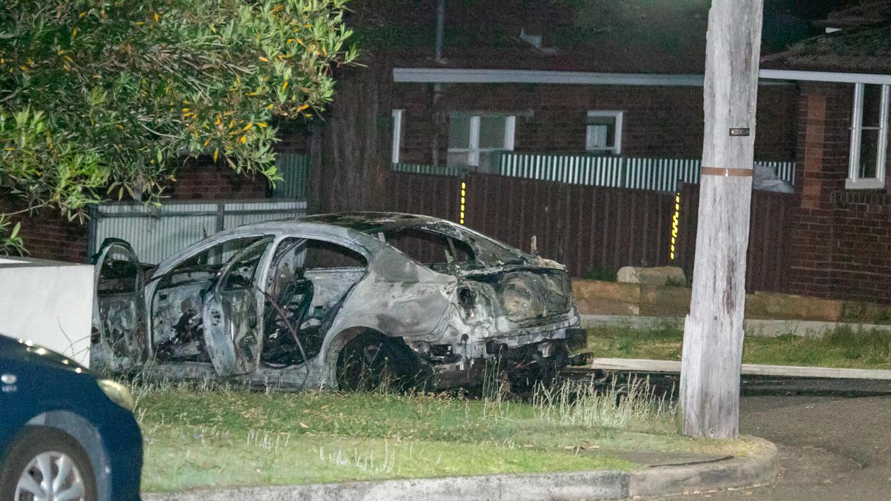 The shell of the torched car on Bibby Street at Carlton.