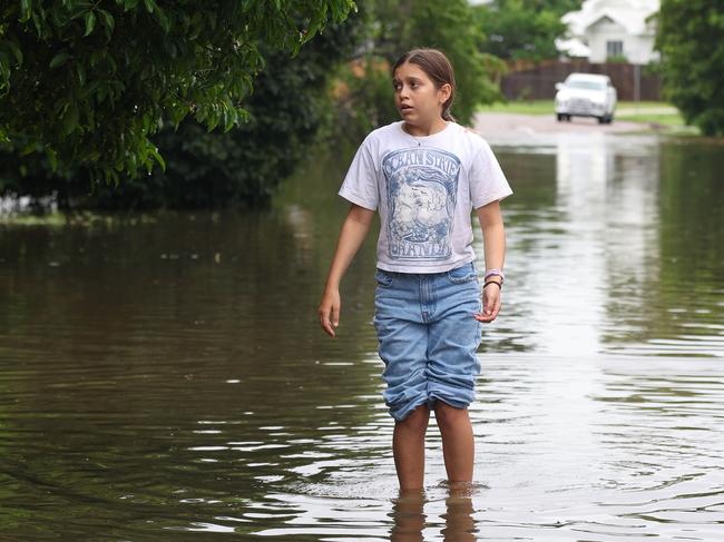 TOWNSVILLE, AUSTRALIA - NewsWire Photos - February 3, 2025: Annabella Giorgas 11 walks along her street in Hermit Park as Townsville residents endure another day of heavy rain and threats of catastrophic flooding. Picture: Adam Head /NewsWire