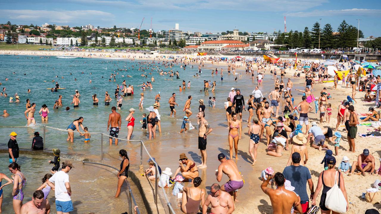 Crowds fill up Bondi Beach early on Australia Day. Picture: Tom Parrish