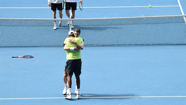 Rajeev Ram (yellow) Joe Salisbury celebrate after beating Max Purcell and Luke Saville. Picture: John Donegan/AFP