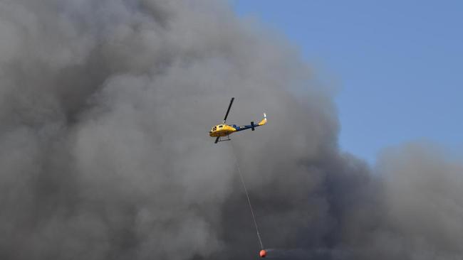 Emergency Services fight to control the fire at Peregian.