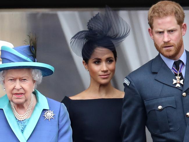 ‘Not impressed’. Queen Elizabeth II with Meghan Markle and Prince Harry in 2018. Picture: Getty Images