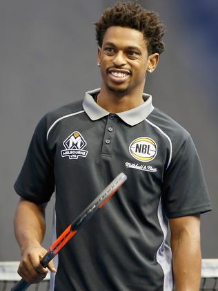 Melbourne United basketabll star Casper Ware tries his hand at tennis. Picture: Getty Images