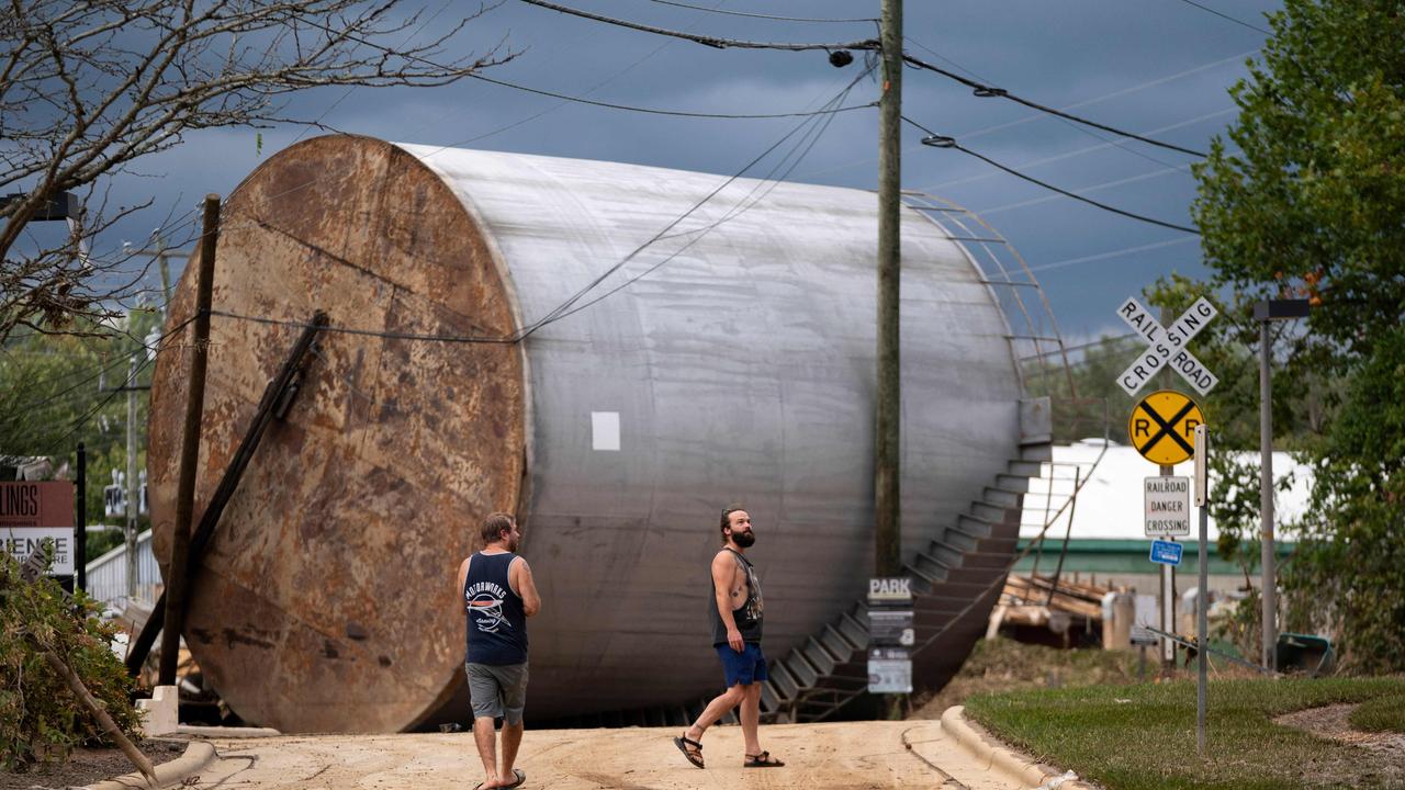 Men inspect the damage from flooding in the Biltmore Village in the aftermath of Hurricane Helene on September 28, 2024 in Asheville, North Carolina. Picture: Sean Rayford/Getty Images/AFP