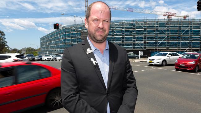 Baulkham Hills Labor Candidate Ryan Tracey on Windsor Rd in Baulkham Hills, NSW. Sunday 25th of November 2018. Mr Tracey is calling for an underpass at Seven Hills Rd to alleviate traffic issues.(AAP Image/Jordan Shields)