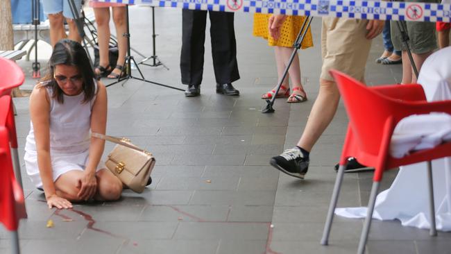 Friend Vivian Vo breaks down in tears outside the Happy Cup cafe in Bankstown where lawyer Ho Ledinh was murdered on Tuesday afternoon. Picture: John Grainger