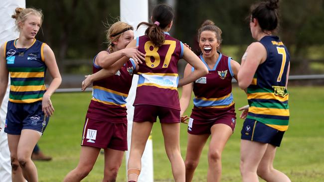 Marcellin’s Olivia Zuccala celebrates a goal with teammates during the VAFA Premier women’s match against St Kevin’s at Bulleen Park. Picture: Mark Dadswell