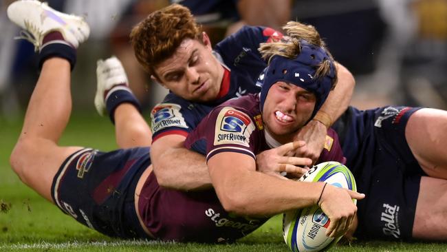 Hamish Stewart of the Queensland Reds scores a try during the round-seven Super Rugby AU match between the Reds and the Melbourne Rebels at Suncorp Stadium on Saturday. Picture: Albert Perez/Getty Images