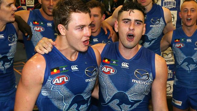 Debutants Tom Murphy and Paul Ahern sing the North Melbourne song. Picture: AAP Images