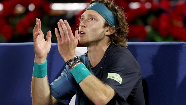 Andrey Rublev reacts to being dismissed by the court supervisor after shouting at a line judge. (Photo by Christopher Pike/Getty Images)