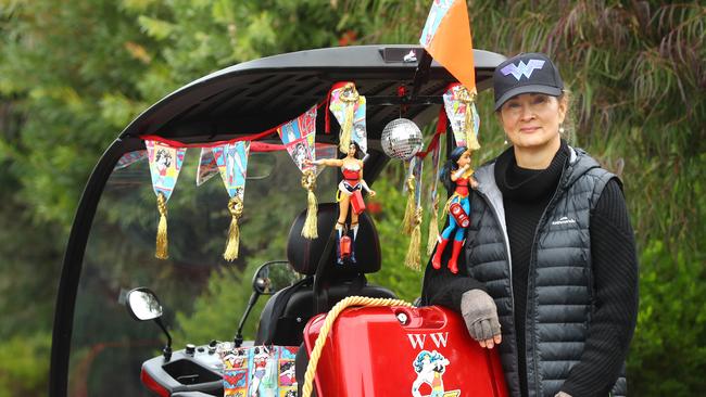 Katie gets around in a decorated mobility scooter. Picture: Alison Wynd