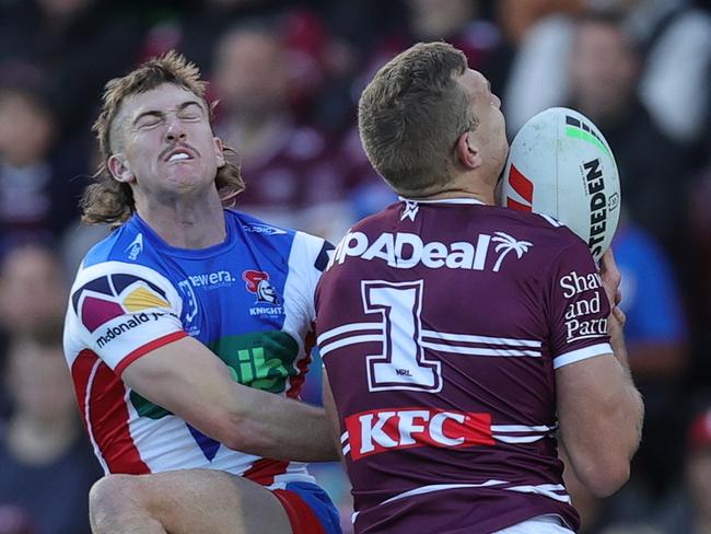 SYDNEY, AUSTRALIA - JULY 14: Tom Trbojevic of the Sea Eagles scores a try during the round 19 NRL match between Manly Sea Eagles and Newcastle Knights at 4 Pines Park on July 14, 2024 in Sydney, Australia. (Photo by Jason McCawley/Getty Images)