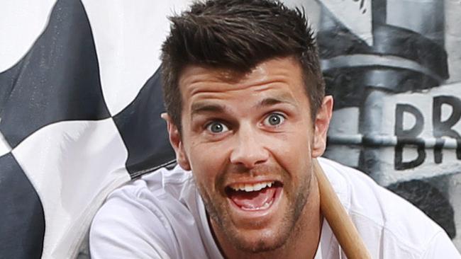 Richmond player Trent Cotchin promotes the Australian MotoGP near mural wall of Melbourne attached to Steveway Real Estate.  at Richmond.   Picture: David Caird