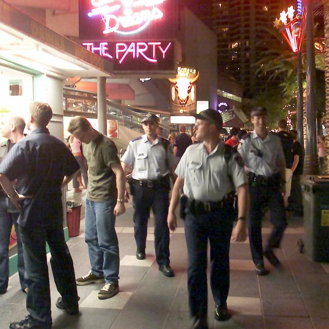 2004 Police officers patrol Surfers Paradise at night.