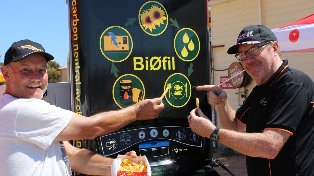 Jon Edwards with rally driver Jurgen Lunsmann at the BiØfil charging station – a world-first fast charging system that is fully off-grid, self-contained and powered by used chip (vegetable) oil from roadhouse deep fryers. Picture: Robin Dean