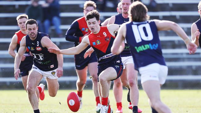 Launceston's Jay Blackberry and North Hobart's Samuel Caswell compete for the ball. Picture: Zak Simmonds