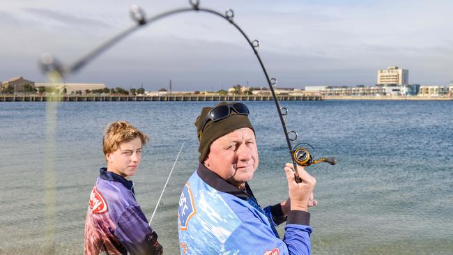 Tim Johnson and son Ryan fishing at the Port River on Sunday. Picture: Brenton Edwards