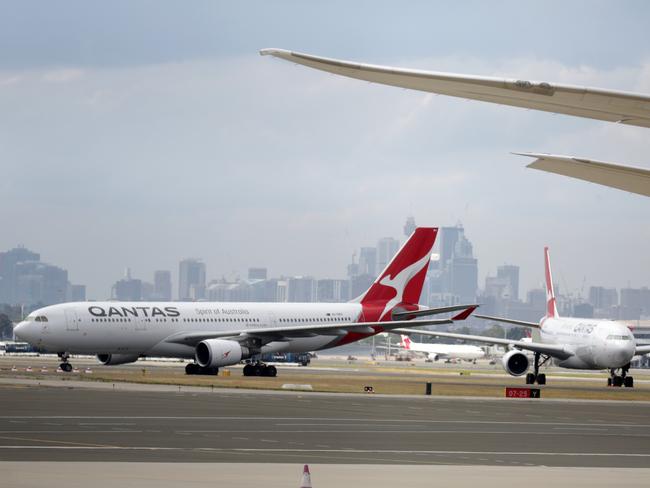 Qantas planes on the tarmac at Sydney Airport. Picture: NCA NewsWire / Christian Gilles