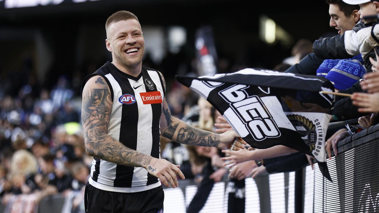 MELBOURNE, AUSTRALIA - JULY 30: Jordan De Goey of the Magpies celebrates with fans after the round 20 AFL match between the Collingwood Magpies and the Port Adelaide Power at Melbourne Cricket Ground on July 30, 2022 in Melbourne, Australia. (Photo by Daniel Pockett/Getty Images)