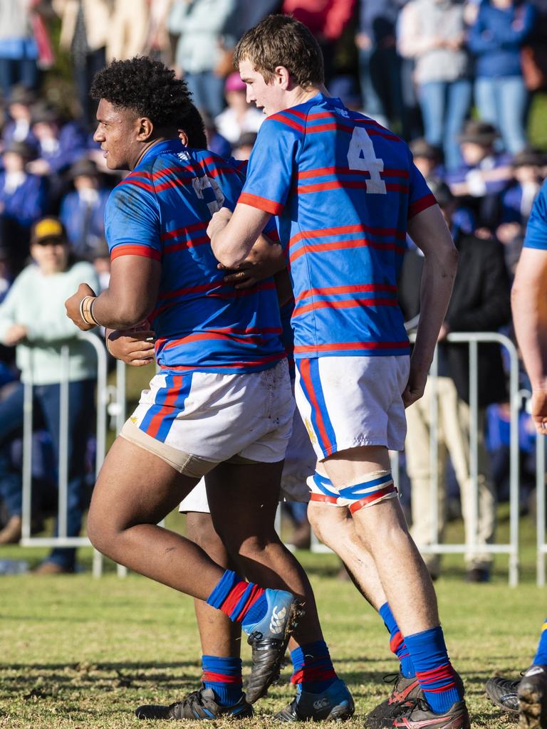 Downlands celebrate a try by Trevor King (left) against Grammar in O'Callaghan Cup on Grammar Downlands Day at Downlands College, Saturday, August 6, 2022. Picture: Kevin Farmer