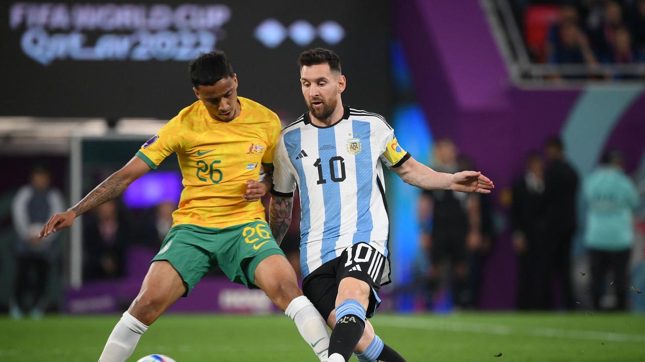 Socceroo Keanu Baccus (left) battles with Argentina’s Lionel Messi during last year’s World Cup. Picture: FRANCK FIFE / AFP