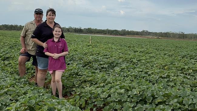 Northern Territory's Charli Fulton, 11, with parents Mark and Kate at their watermelon farm. Picture: Supplied