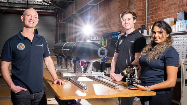 Southern Launch chief executive Lloyd Damp, left, with graduate engineers Matthew Willson and Farisha Jamal at the company’s facility in Hindmarsh. Picture: NCA NewsWire / Morgan Sette