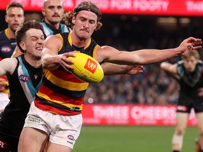 ADELAIDE, AUSTRALIA - AUGUST 20: Sam Berry of the Crows is tackled by Zak Butters of the Power during the 2022 AFL Round 23 match between the Port Adelaide Power and the Adelaide Crows at Adelaide Oval on August 20, 2022 in Adelaide, Australia. (Photo by Sarah Reed/AFL Photos via Getty Images)