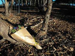 Flowers left next to a police roadblock where police are investigating the death of seven people in suspected murder-suicide in Osmington, east of Margaret River. Picture: RICHARD WAINWRIGHT