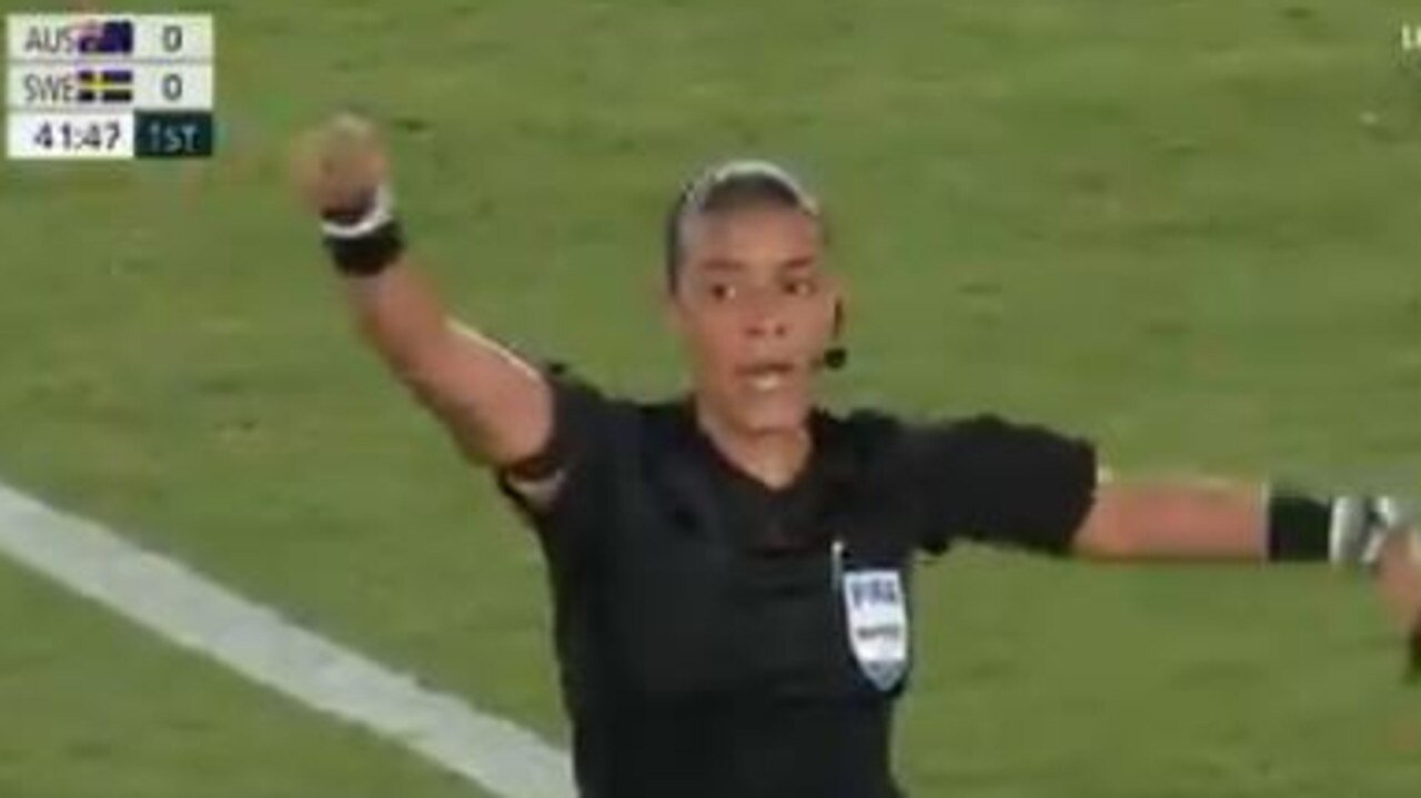 Referee Melissa Borjas in the process of denying Sam Kerr's goal.