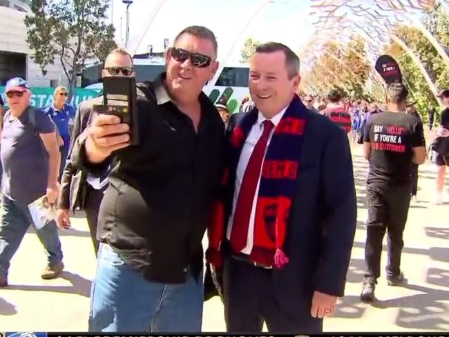 Mark McGowan arrives with Demons scarf. Photo: Twitter, @7AFL.