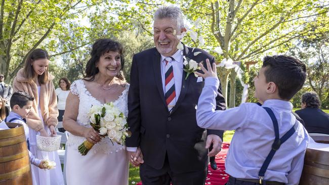 Chris Harwood marruing his bride Rita Harwood-Romeo in the Rose Garden at Sunnybrae. Picture: Kelly Barnes