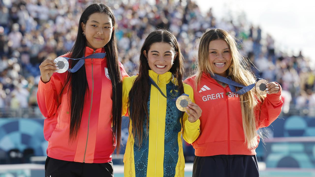 Australian gold medallist Arisa Trew (middle) with silver medallist Cocona Hiraki (left) and Sky Brown (right) with the bronze. Picture: Michael Klein