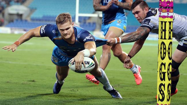 Dale Copley scores a try in the corner for the Titans. Picture: Richard Gosling